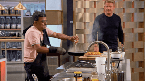Gordon Ramsay reacts as a cook sets fire to their pan dramatically
