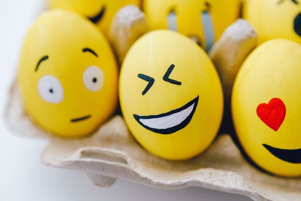 Yellow painted eggs With various facial expressions